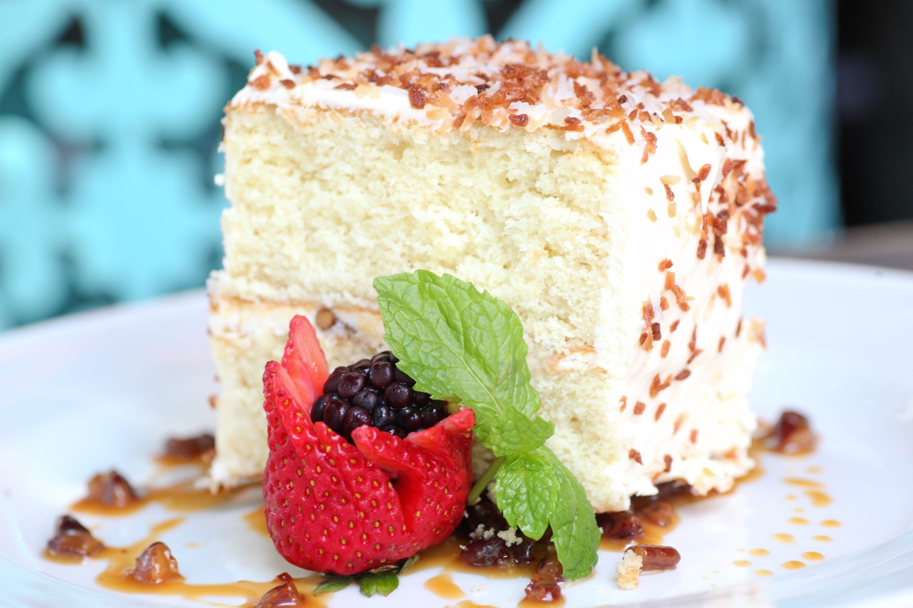 Postre de coco — layered buttermilk cake with toasted coconut and pecan-caramel sauce
